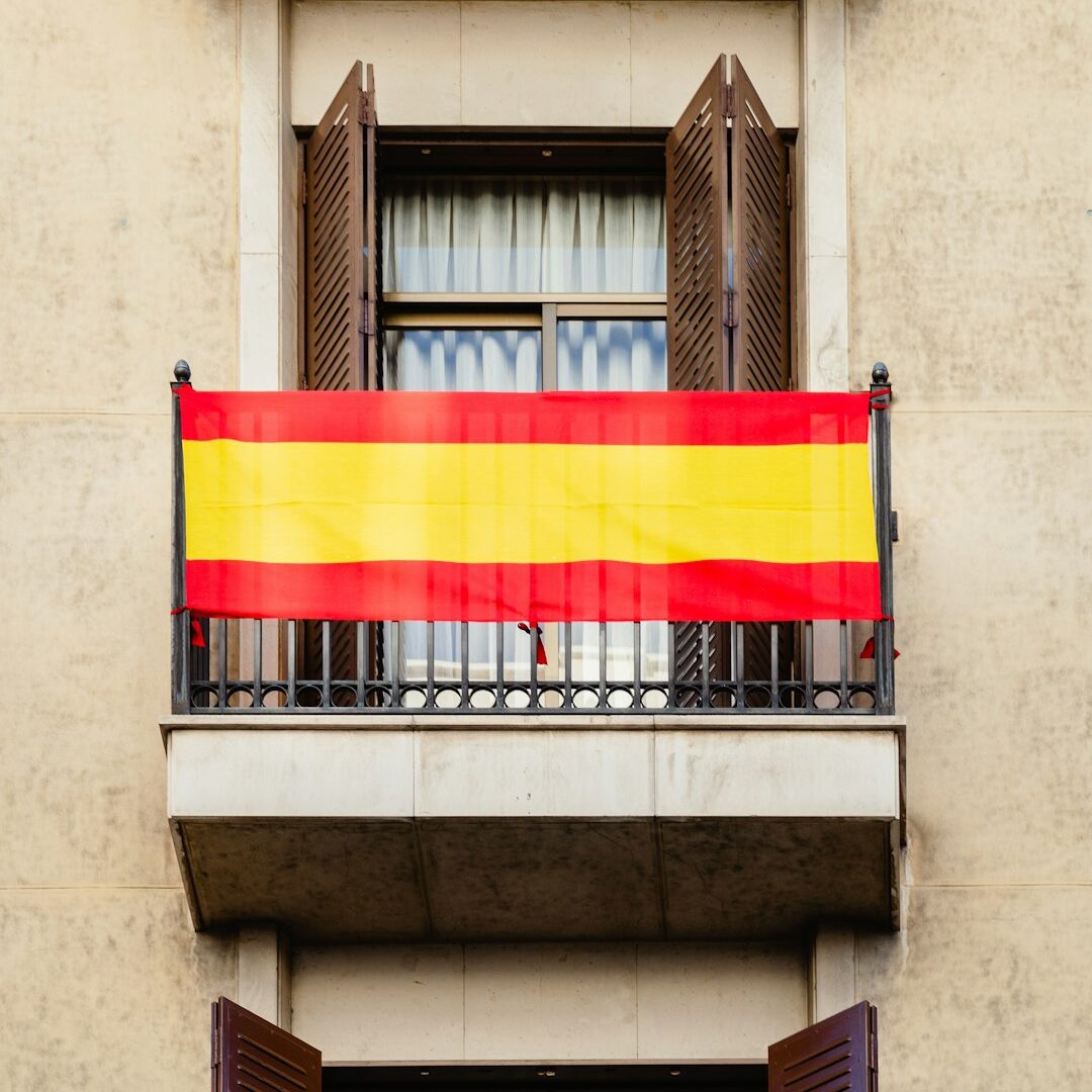 a balcony with a flag hanging from it